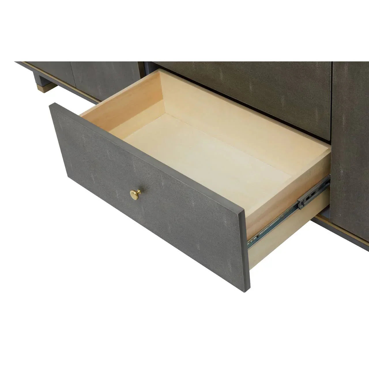 Grey wooden sideboard drawer with brass knob shown open on metal runners