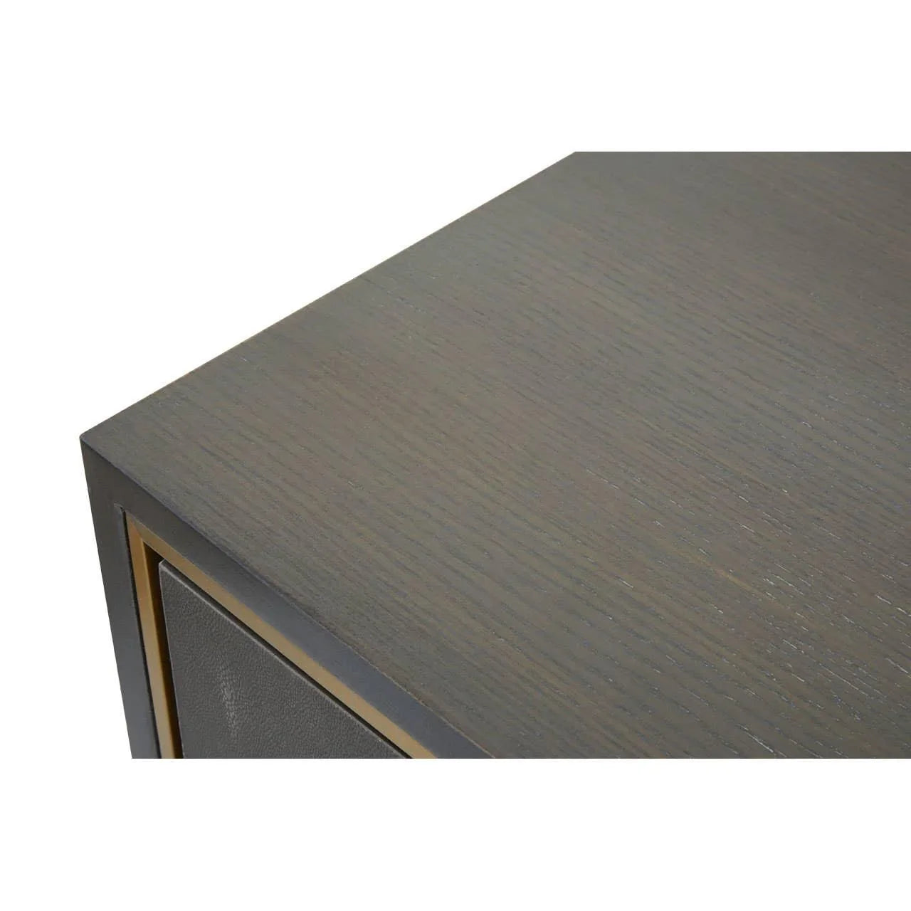 Close-up of dark wood side table corner with brass trim detail