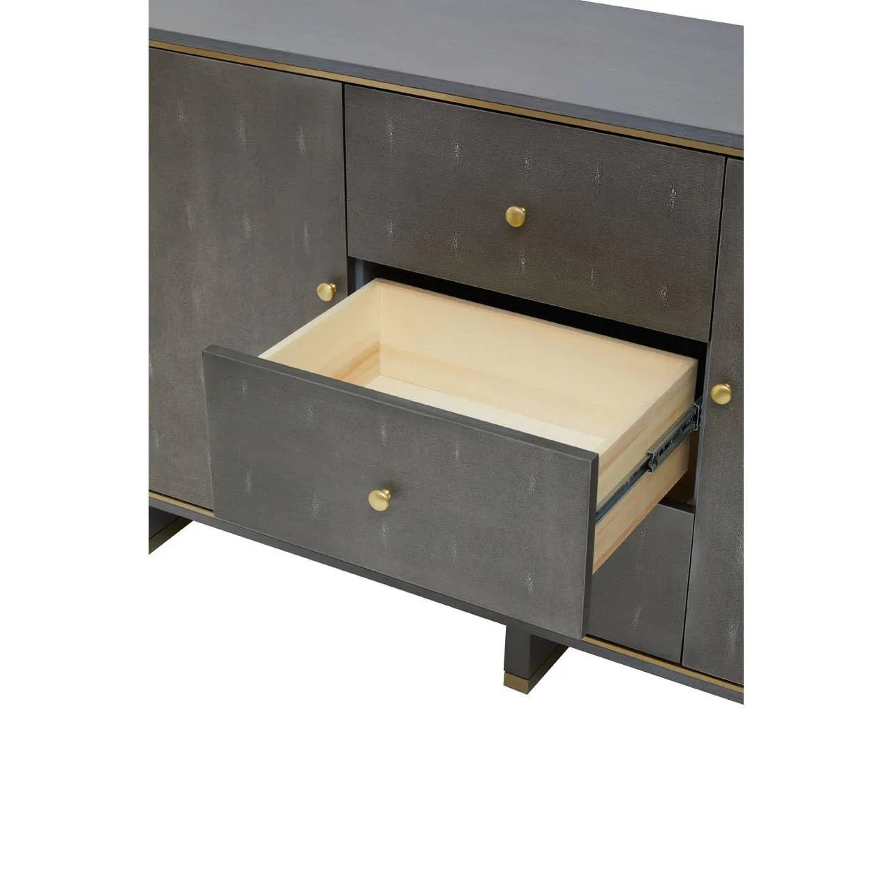 Grey sideboard cabinet with gold knobs and open drawer showing light wood interior