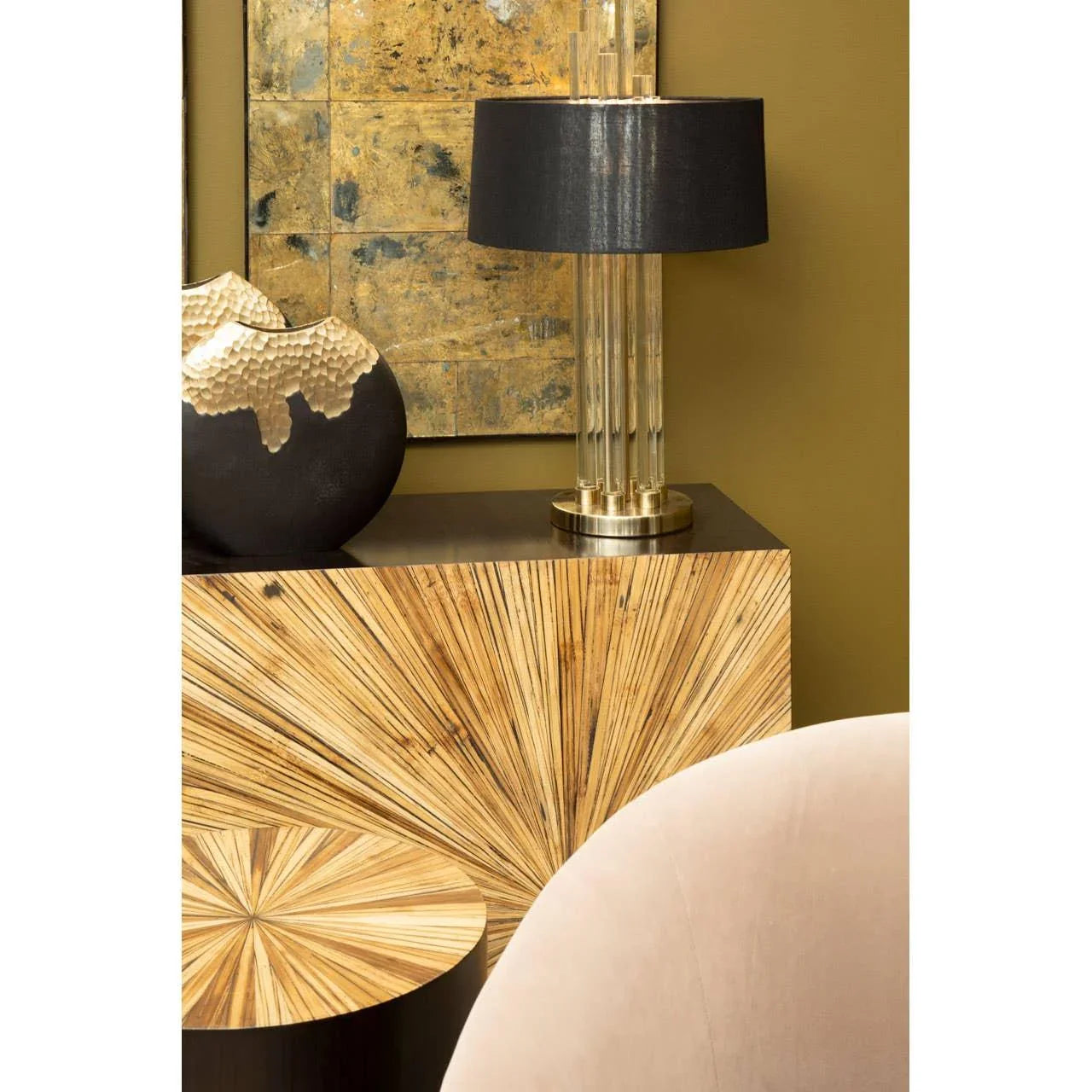 Modern sideboard with sunburst wood finish, black table lamp, gold accent vase
