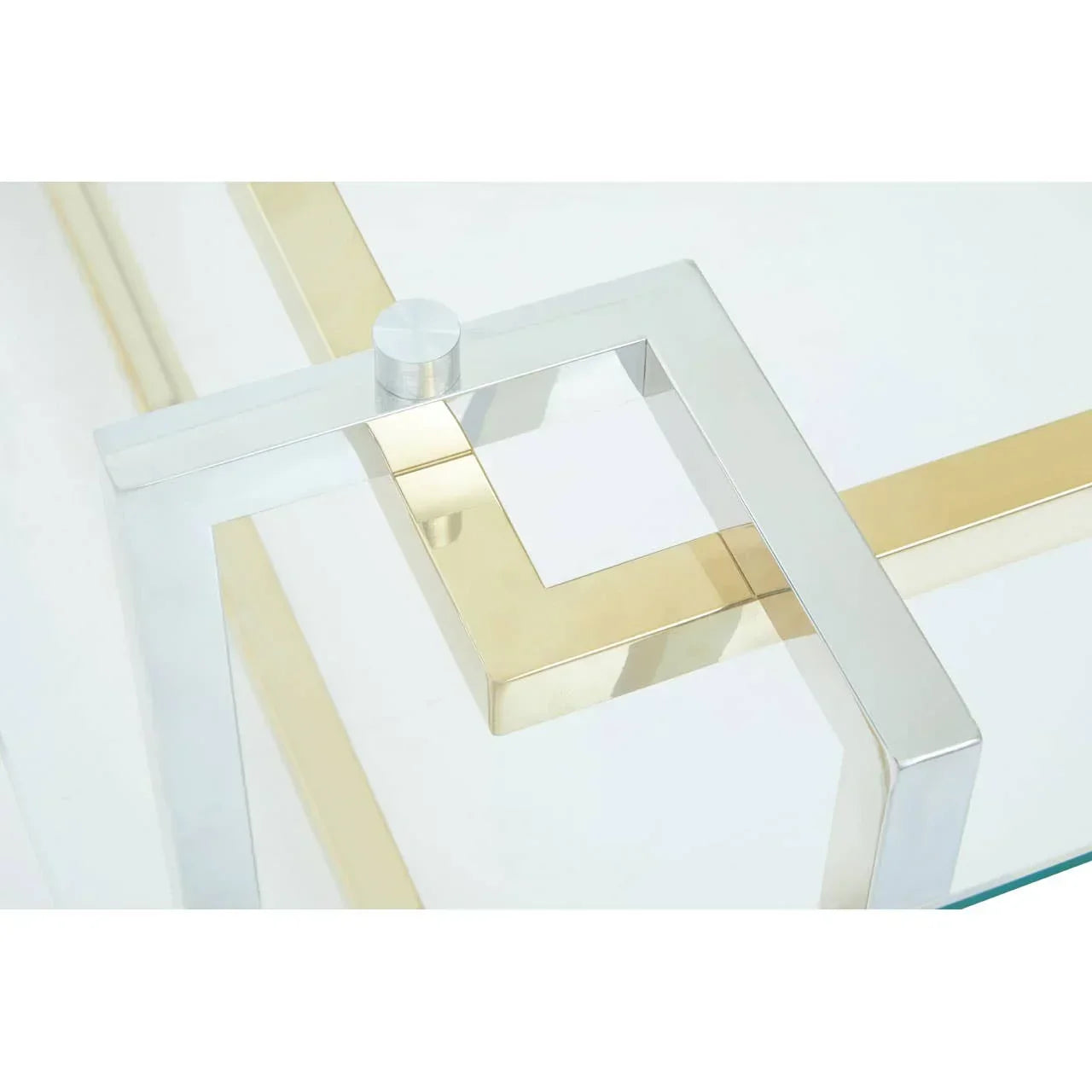 Glass coffee table with chrome and gold metal frame detail, modern living room furniture