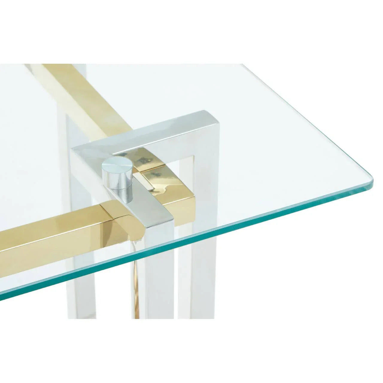 Glass top table with gold and chrome metal frame corner detail