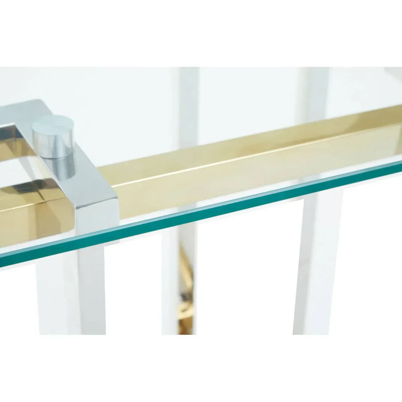 Closeup of glass dining table with gold and chrome metal frame detail