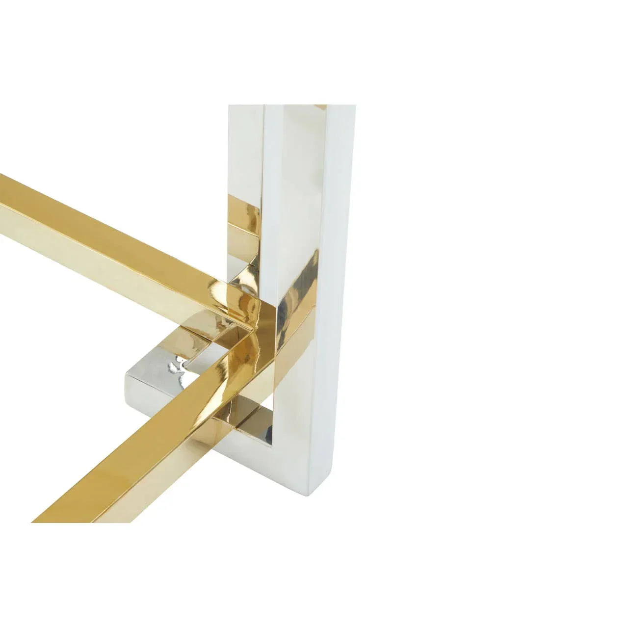 Close-up of gold and chrome metal table legs with modern geometric design