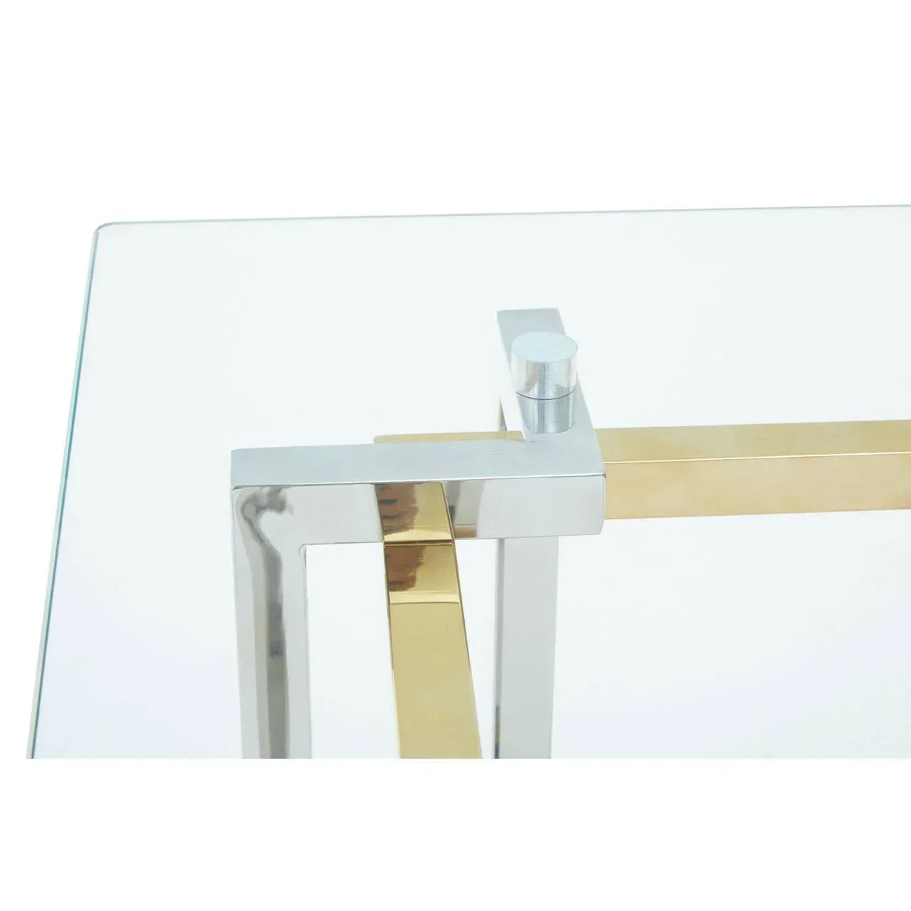 Glass top coffee table with chrome and gold metal frame, close-up of corner detail