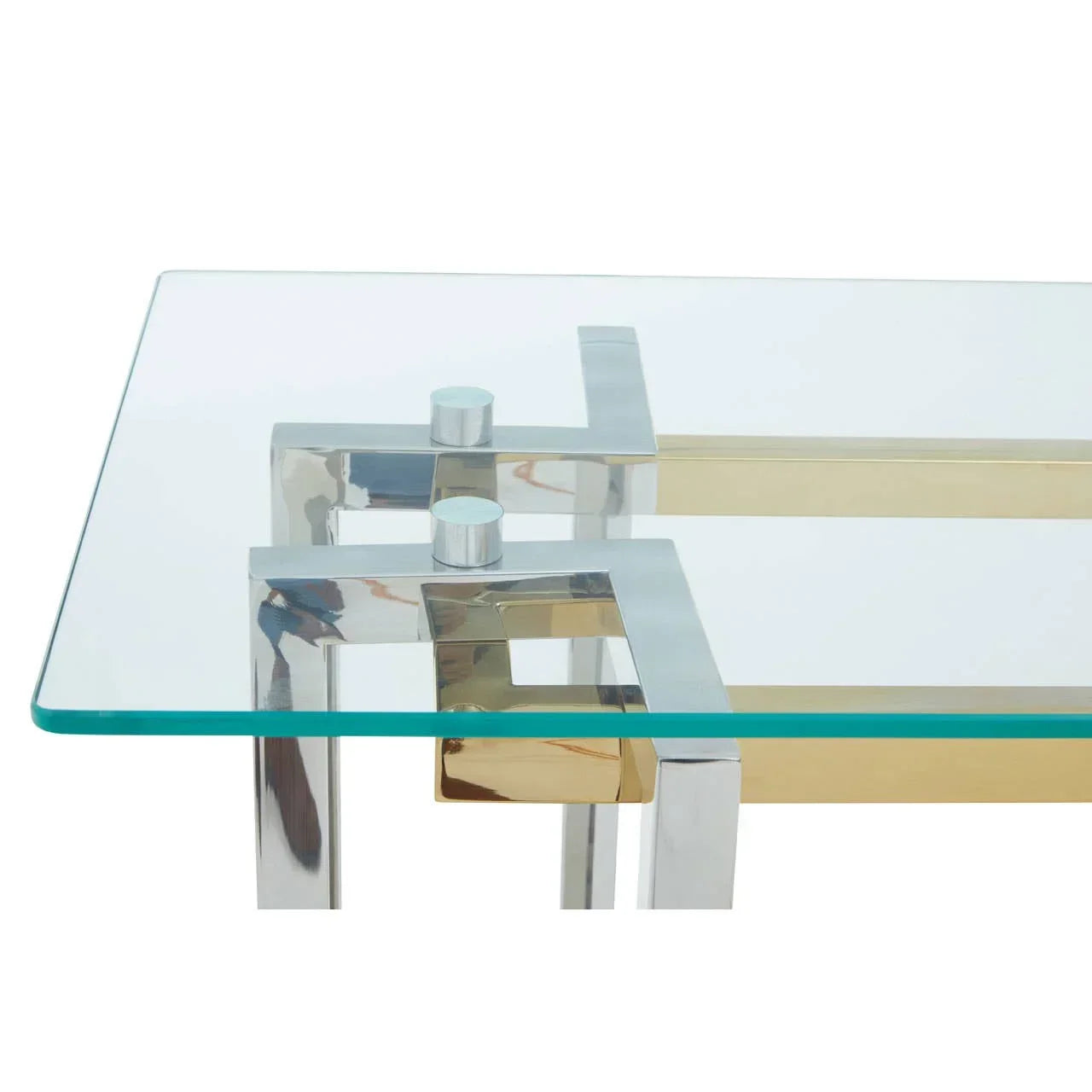 Glass coffee table with chrome and gold geometric frame, closeup of corner detail