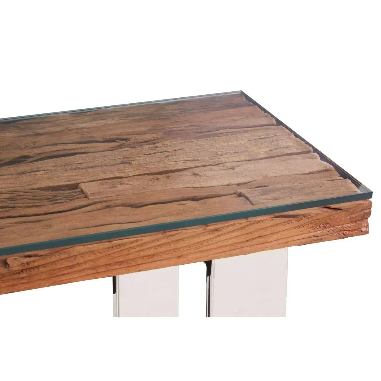 Close view of wooden dining table with textured top and glass surface, chrome legs visible