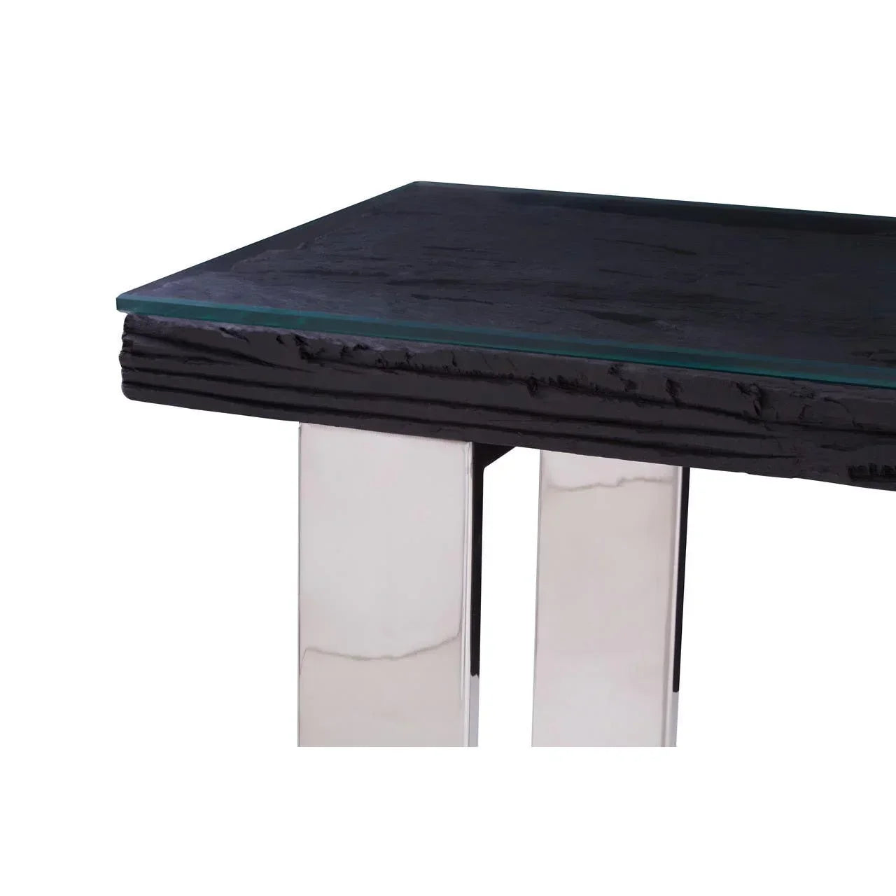 Glass top dining table with textured black wood edge and chrome metal legs close-up