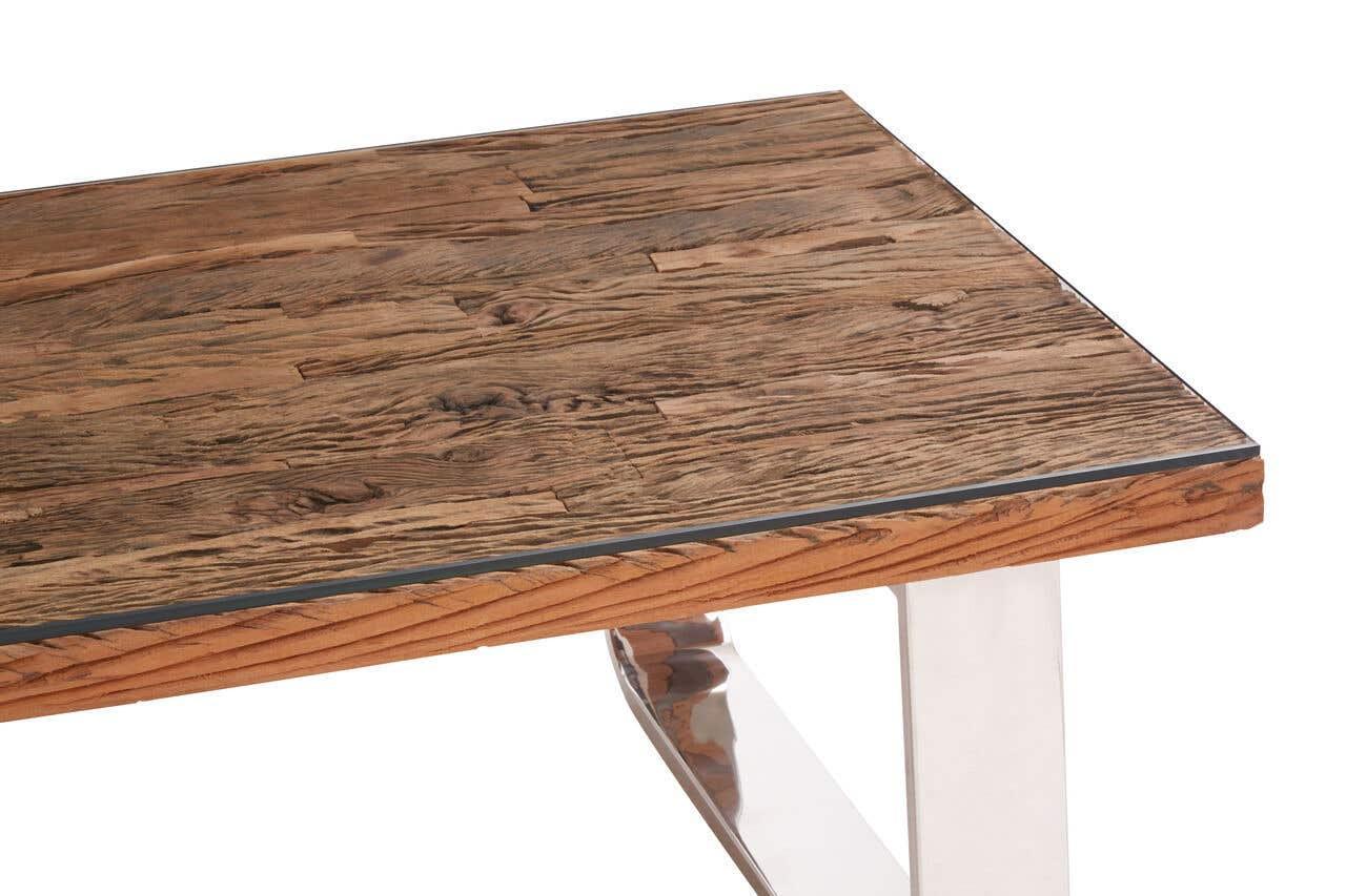 Rectangular wooden dining table with metal legs, close-up of wood grain tabletop