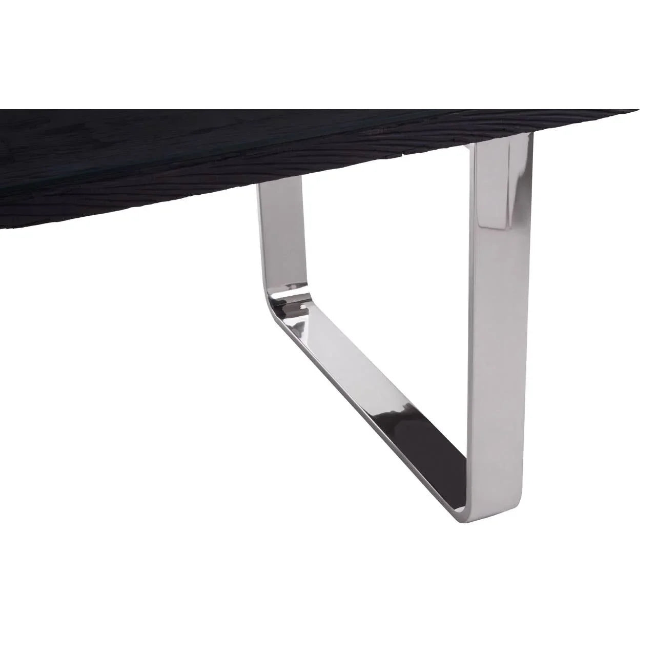 Closeup of dining table with black wood top and chrome metal leg