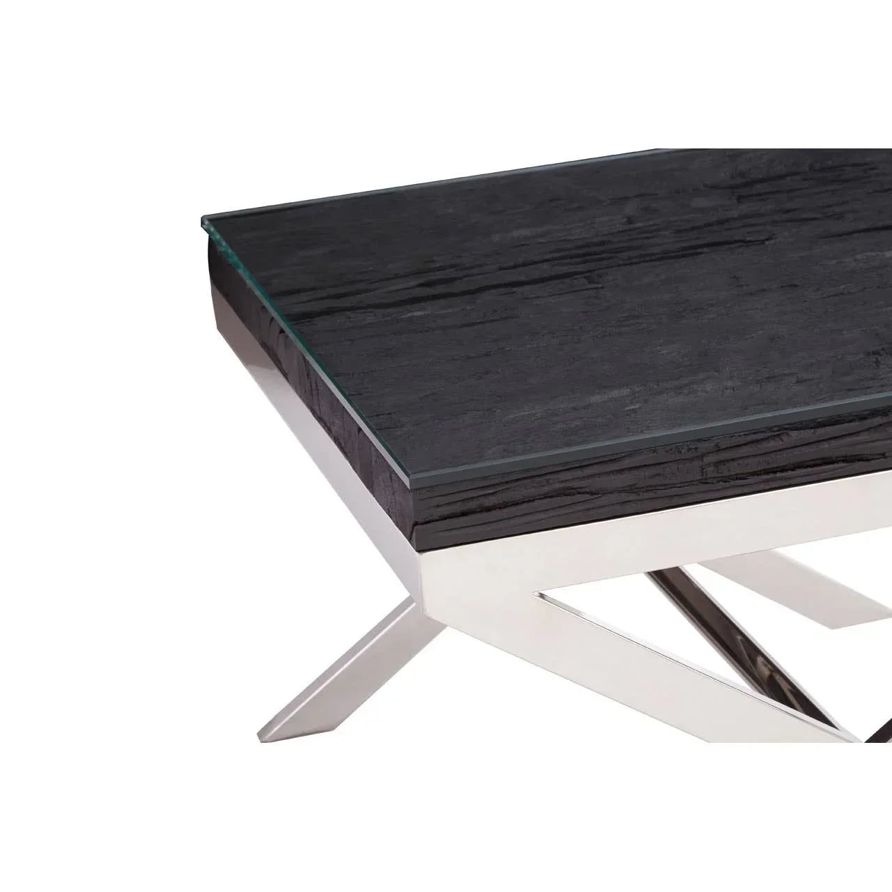 Black wood coffee table with glass top and chrome crossed legs, close corner view