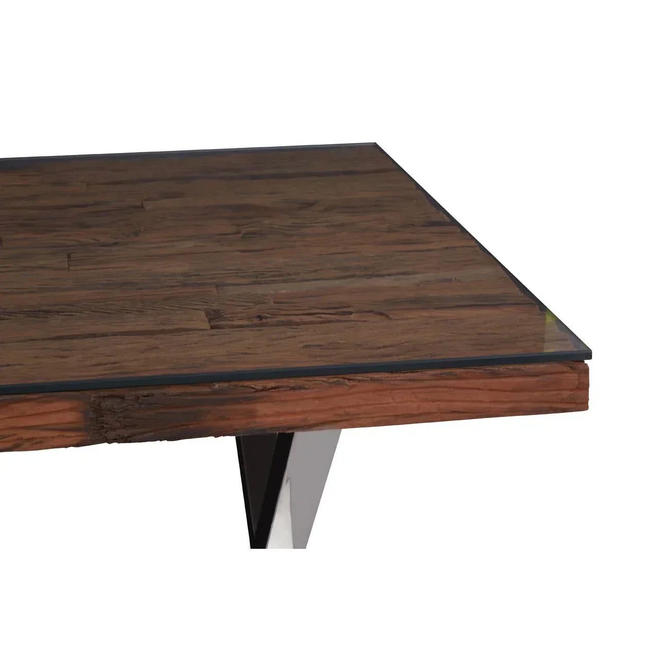 Corner view of wooden dining table with glass top and metal legs