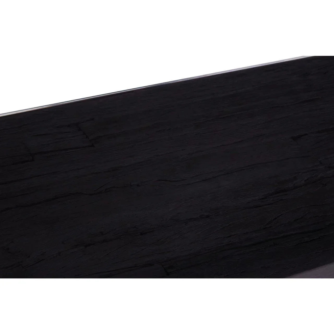 Closeup of black wood dining table top with textured grain finish