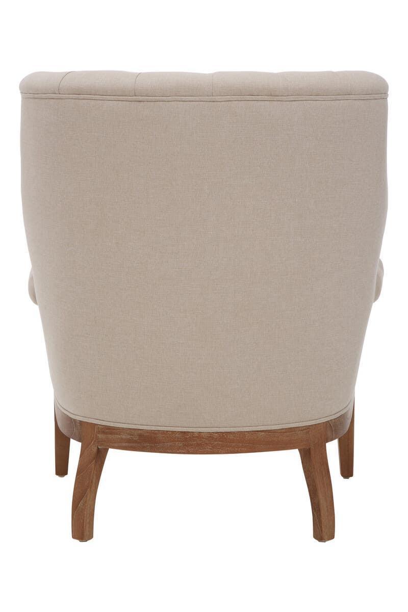 Beige fabric armchair with tufted backrest and wooden legs, rear view