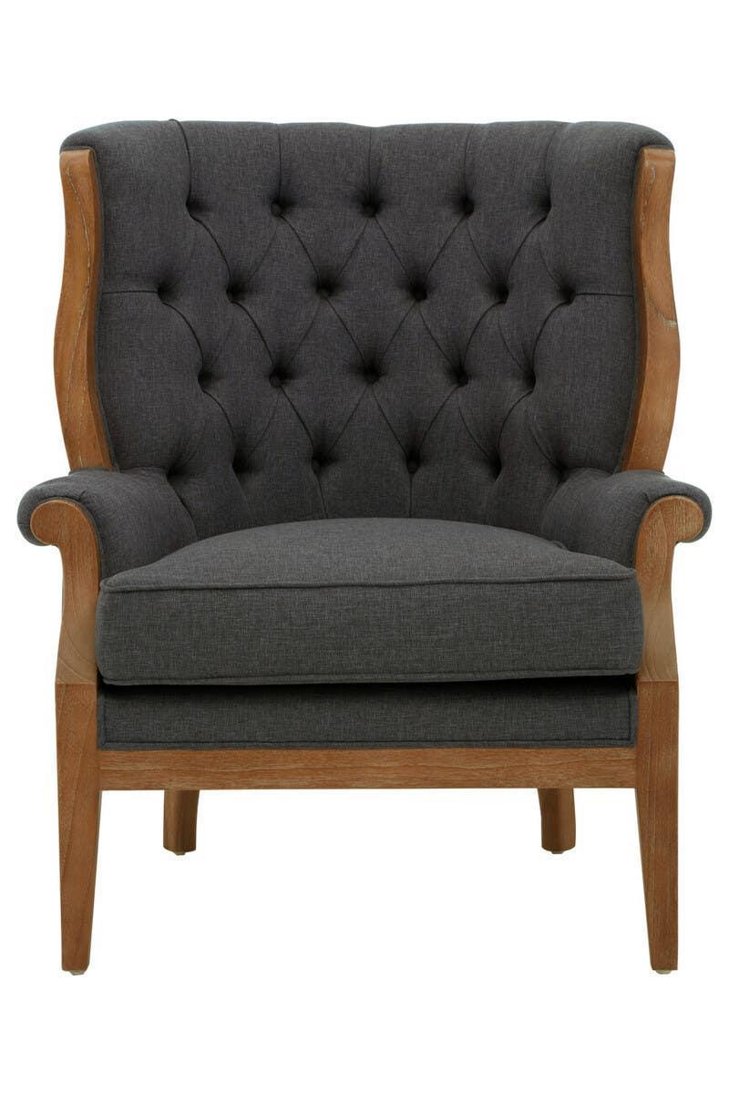 Dark grey fabric armchair with button-tufted backrest and light wood frame, front view