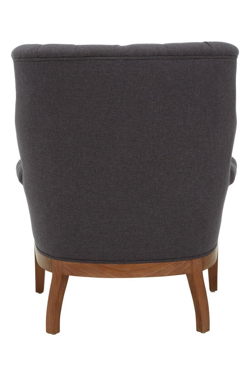 Back view of dark grey upholstered armchair with wooden legs
