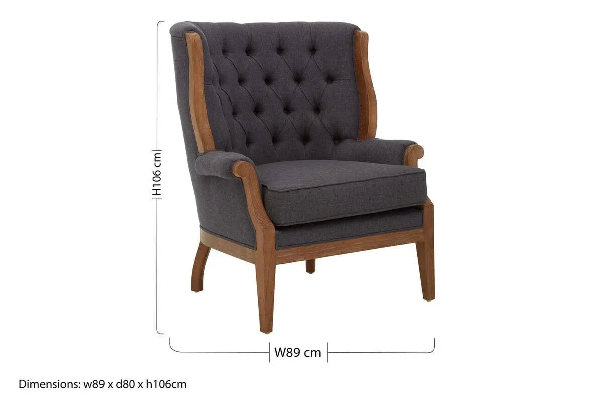 Dark grey upholstered armchair with tufted backrest, wooden frame, and visible dimensions