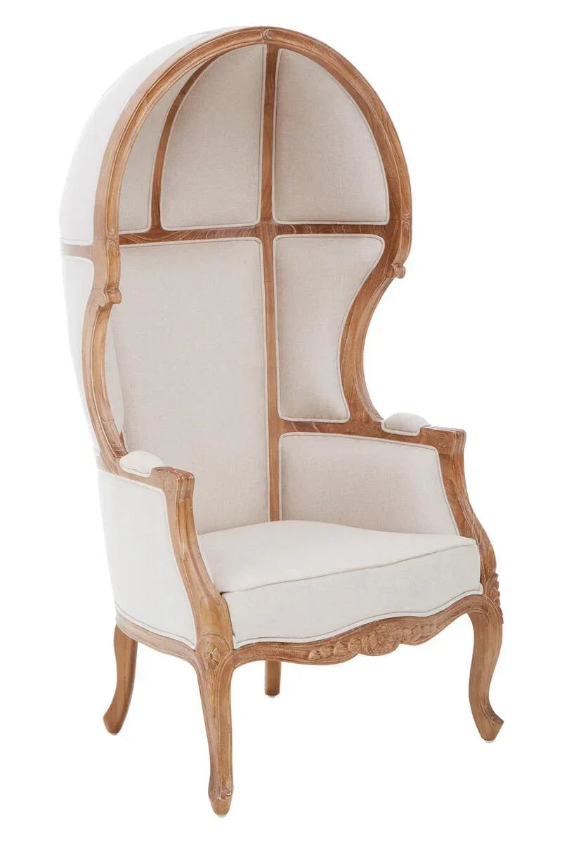 Beige dome canopy armchair with carved wood frame and high curved back