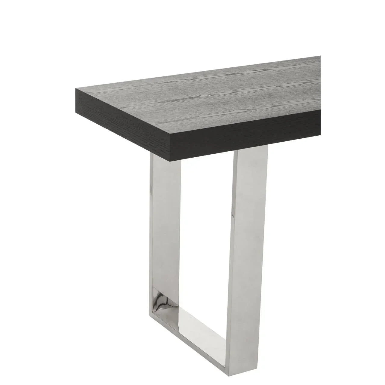 Modern dining table corner with grey wood top and chrome metal leg