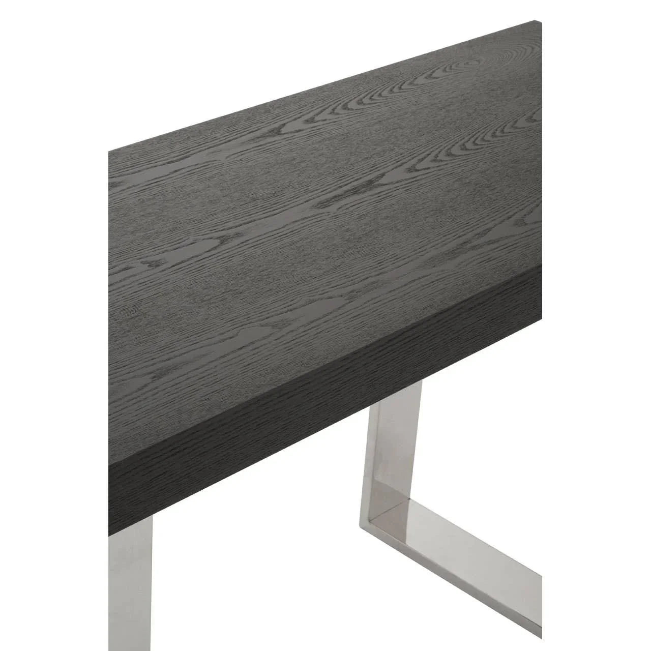 Close-up of modern dark wood table with brushed metal legs