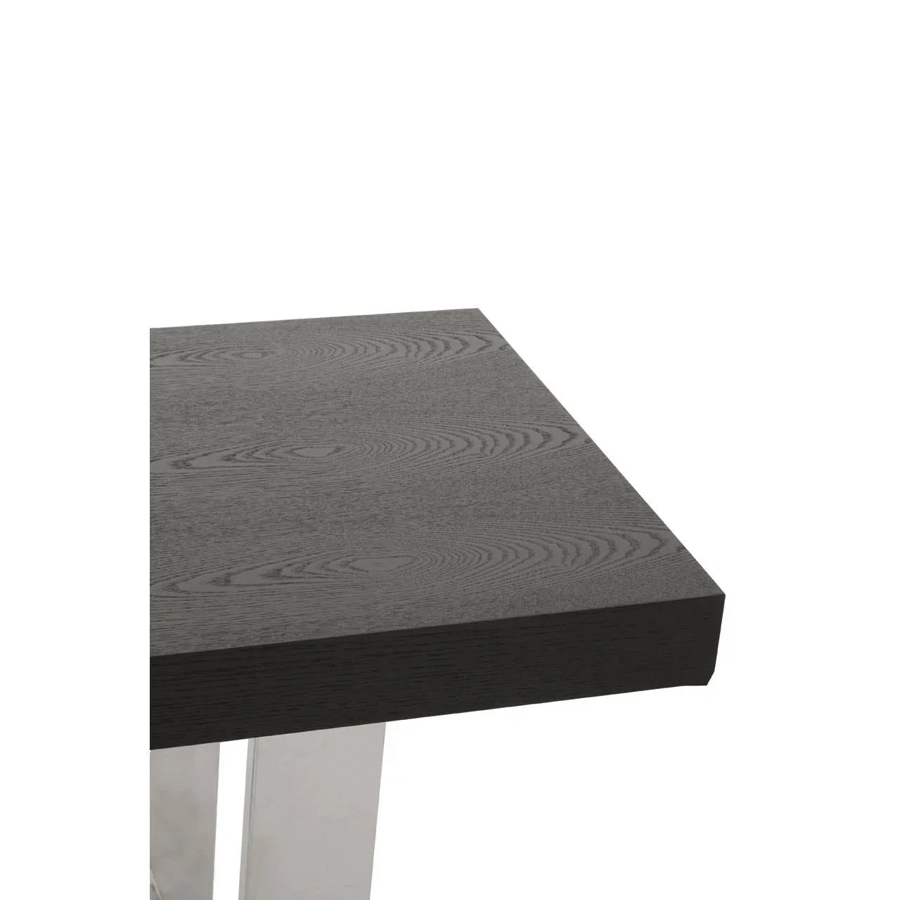 Dark wood dining table corner with chrome metal legs and textured grain finish