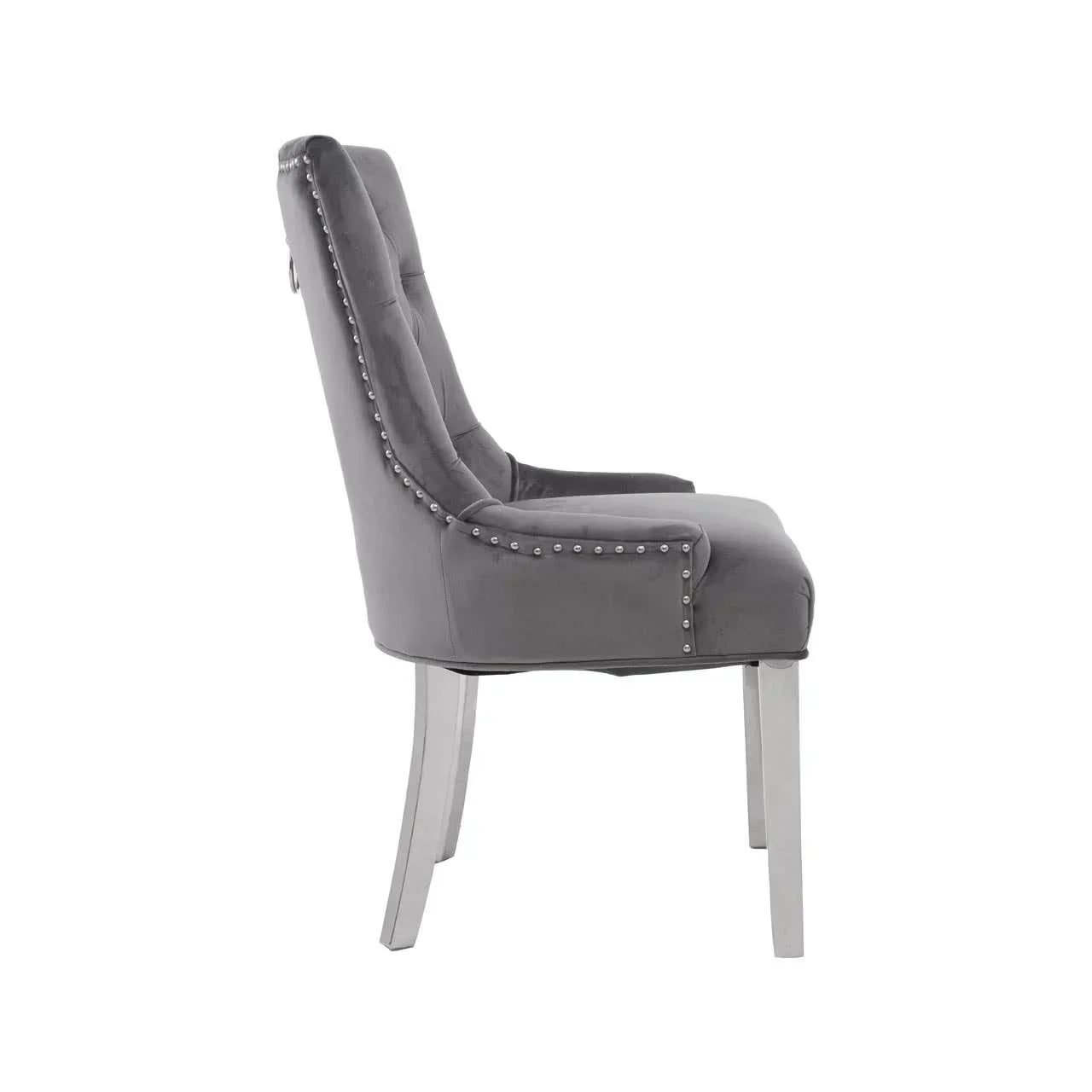 Grey velvet dining chair with silver stud trim and chrome legs side view