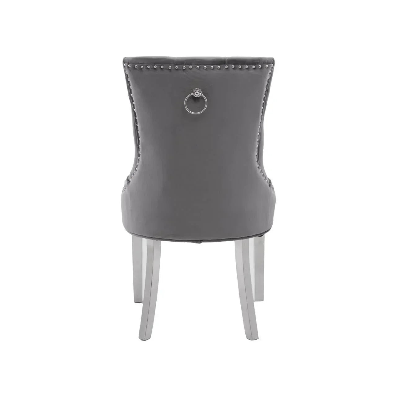 Grey velvet dining chair with chrome legs, silver stud trim, and knocker handle on back
