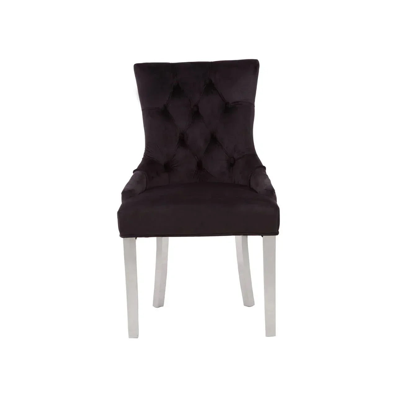 Black velvet dining chair with tufted backrest and silver legs, front view
