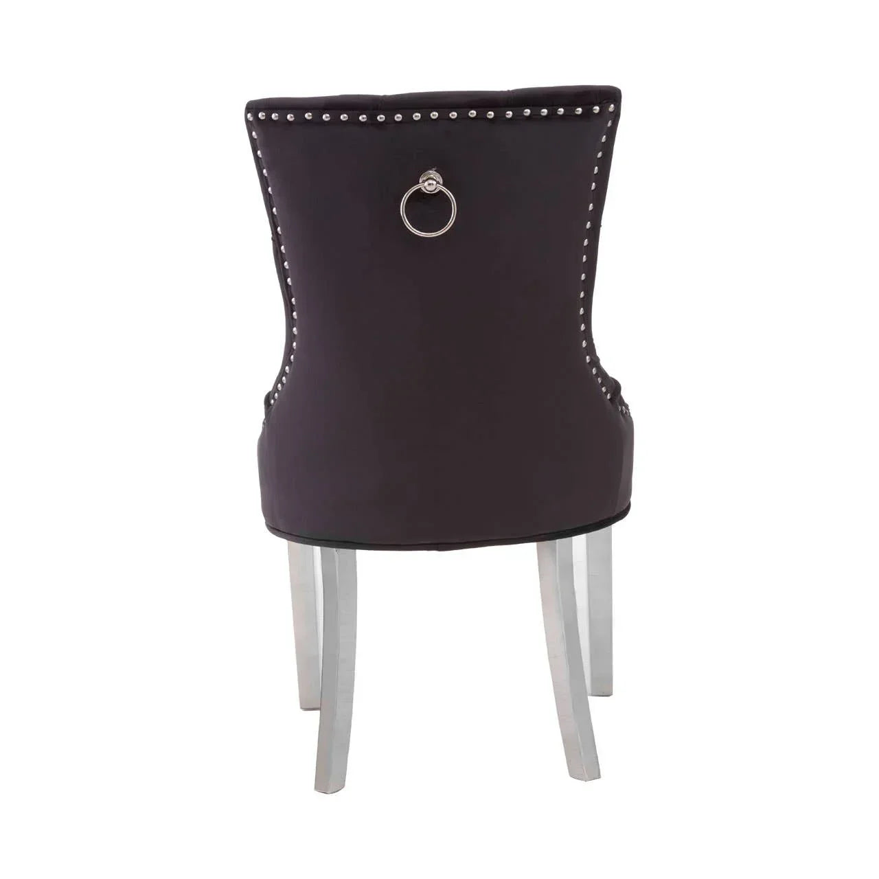 Dark upholstered dining chair with silver stud trim, chrome knocker and light wooden legs