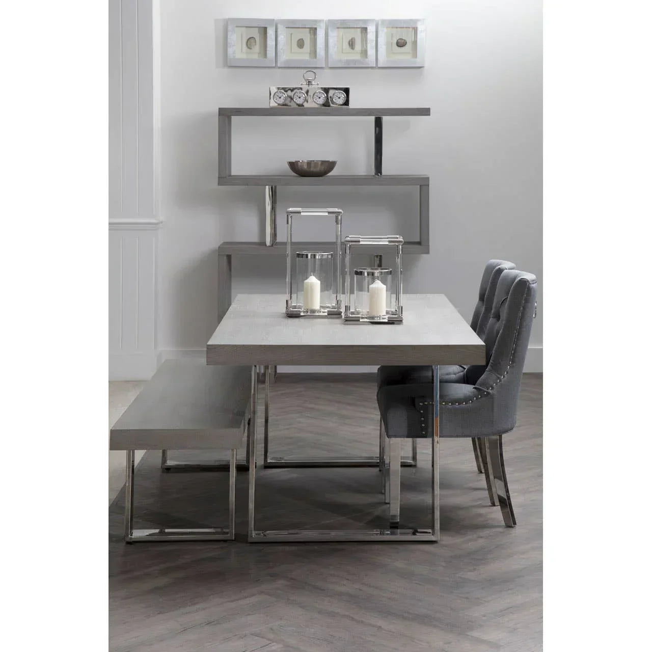 Modern dining table set with grey chairs, matching bench, and decorative shelving unit