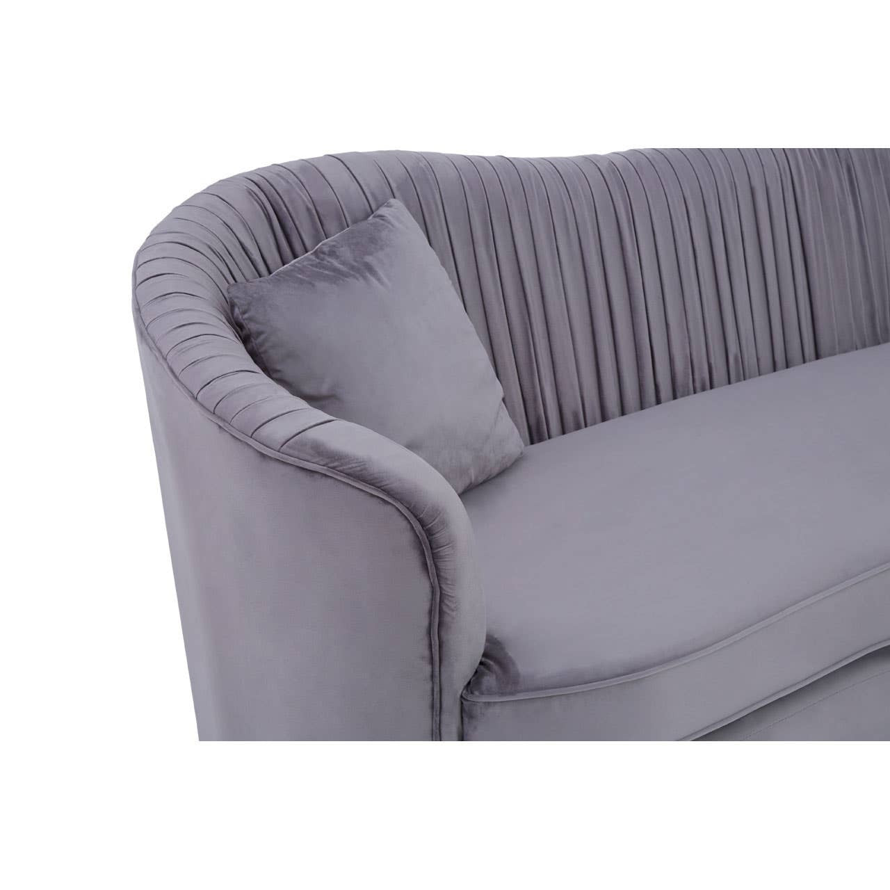 Grey pleated velvet sofa featuring a curved backrest and a plush seat, accompanied by a matching cushion. The fabric has a soft texture, and the pleats add a stylish detail to the overall design