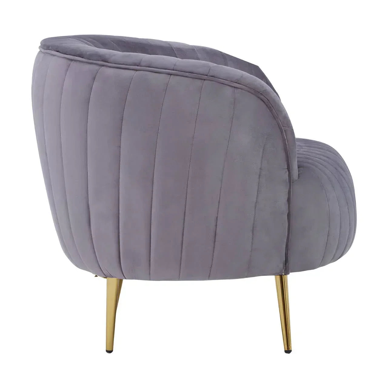 Side view of grey velvet accent chair with gold metal legs and vertical stitching
