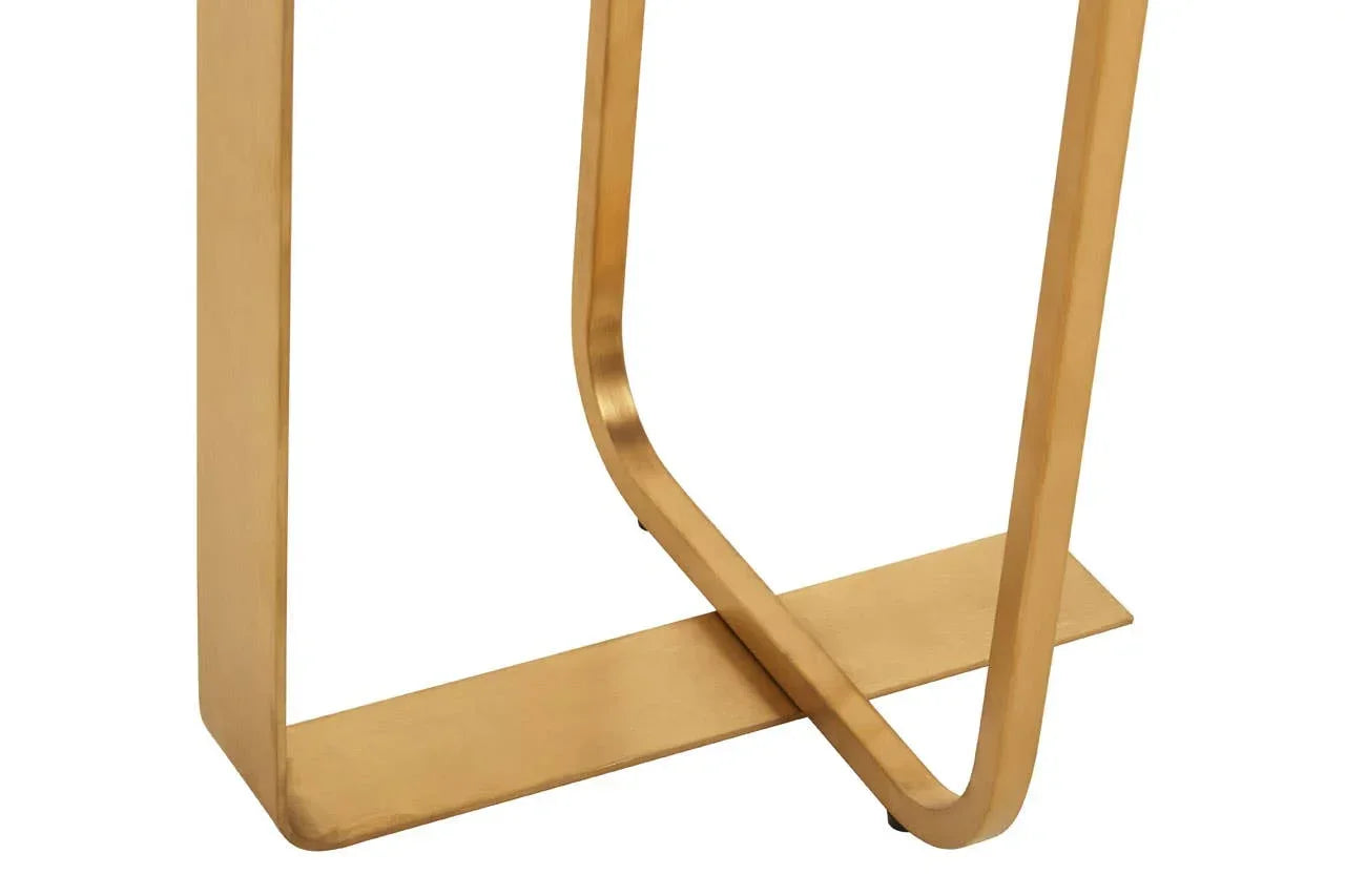 Closeup of gold metal table leg with modern geometric design