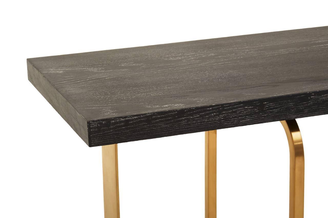 Black wood table top with gold metal legs, modern dining table corner view