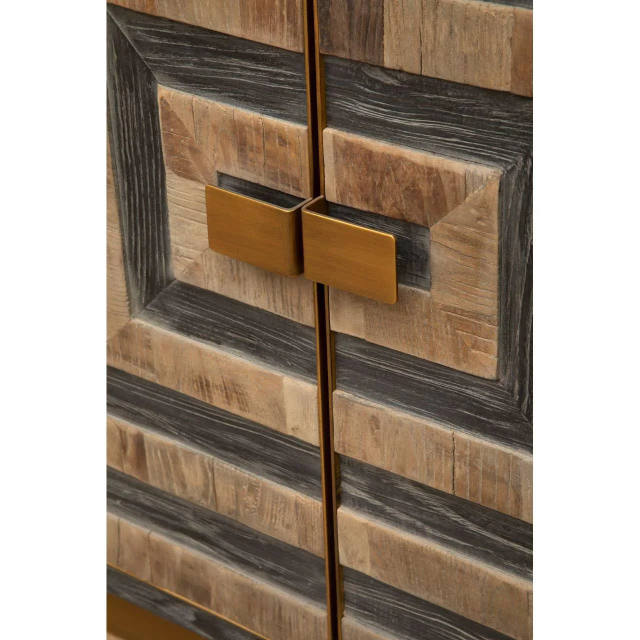 Close-up of wooden cabinet doors with brass handles and geometric pattern