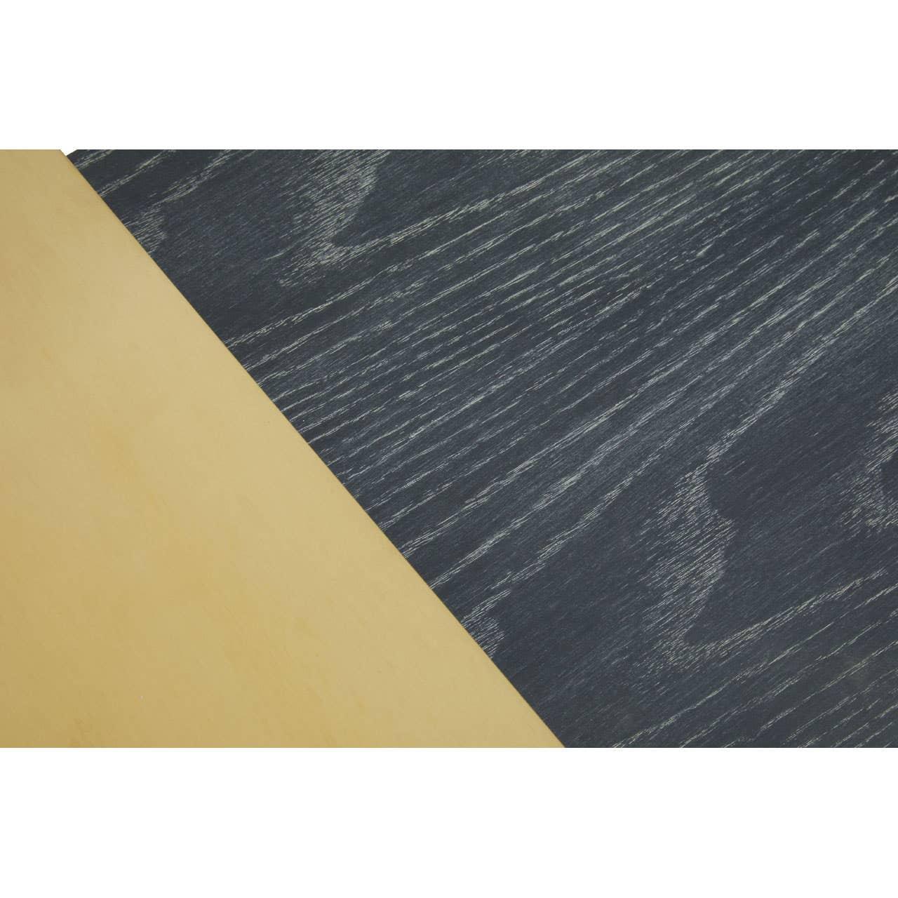 Oak dining table closeup with black stained wood grain and natural finish contrast
