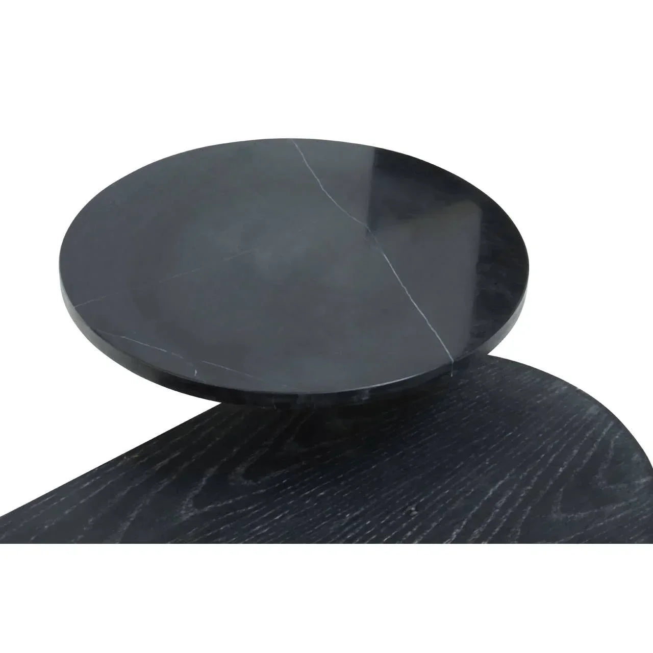 Round black marble coffee table top with subtle white veining and wood surface detail