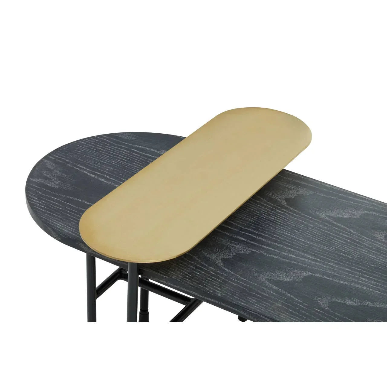 Black wood grain coffee table with gold metal tray on top, close-up angled view