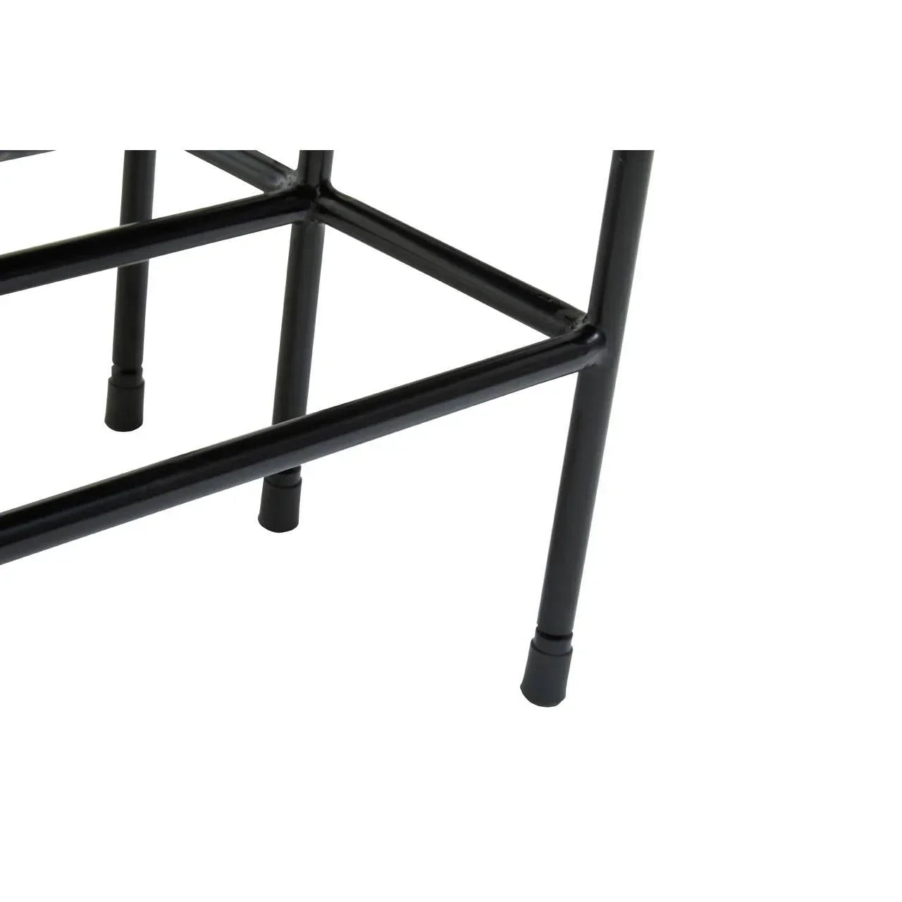 Black metal furniture legs and frame with rubber feet, close-up of corner supports