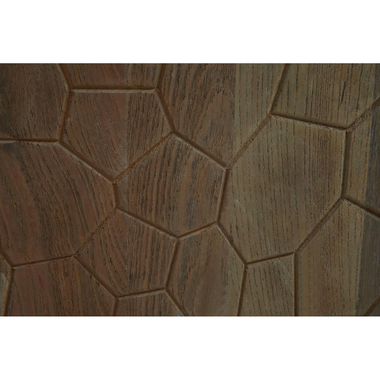Brown wooden furniture surface with geometric carved pattern close-up