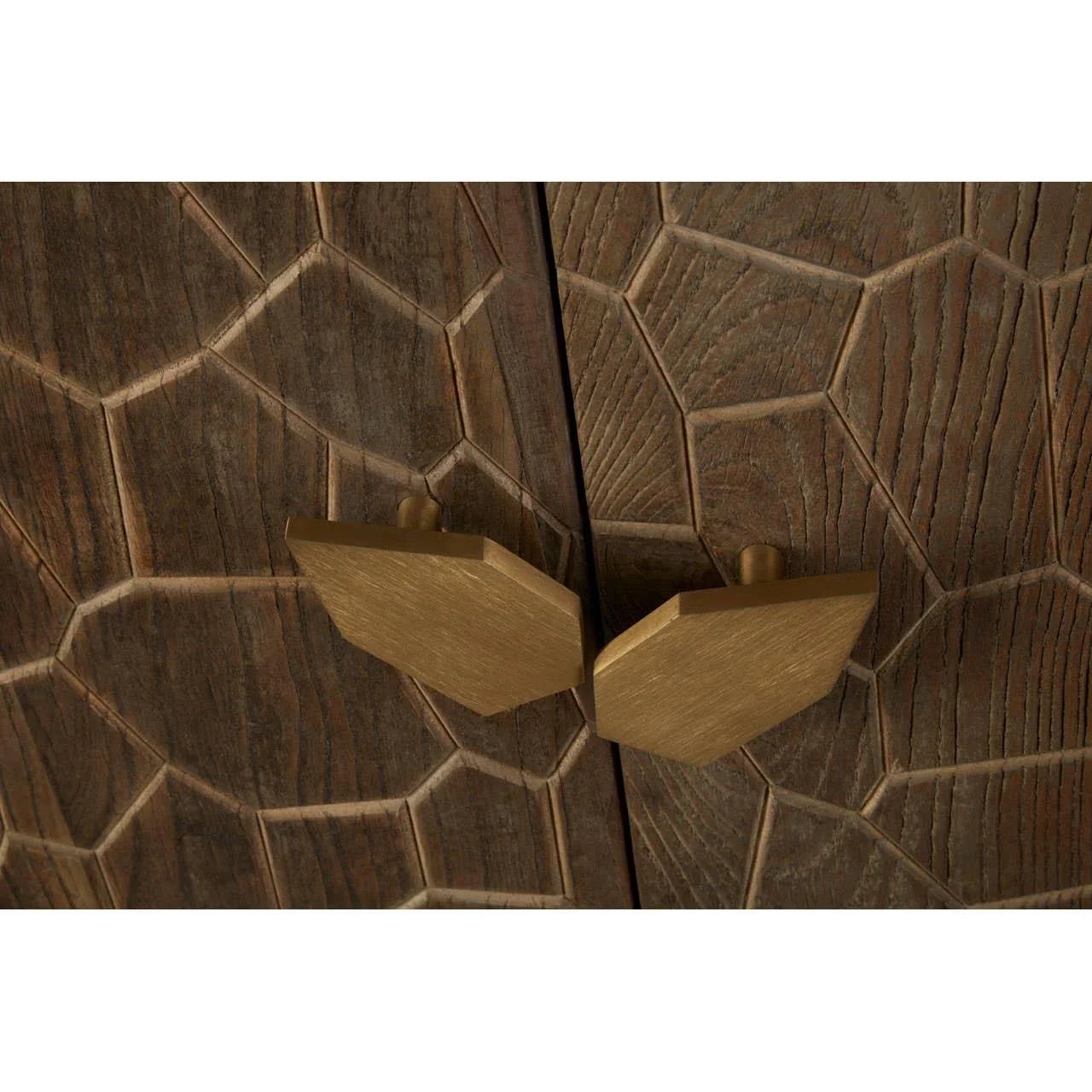 Geometric brass cabinet handles on textured dark wood furniture door