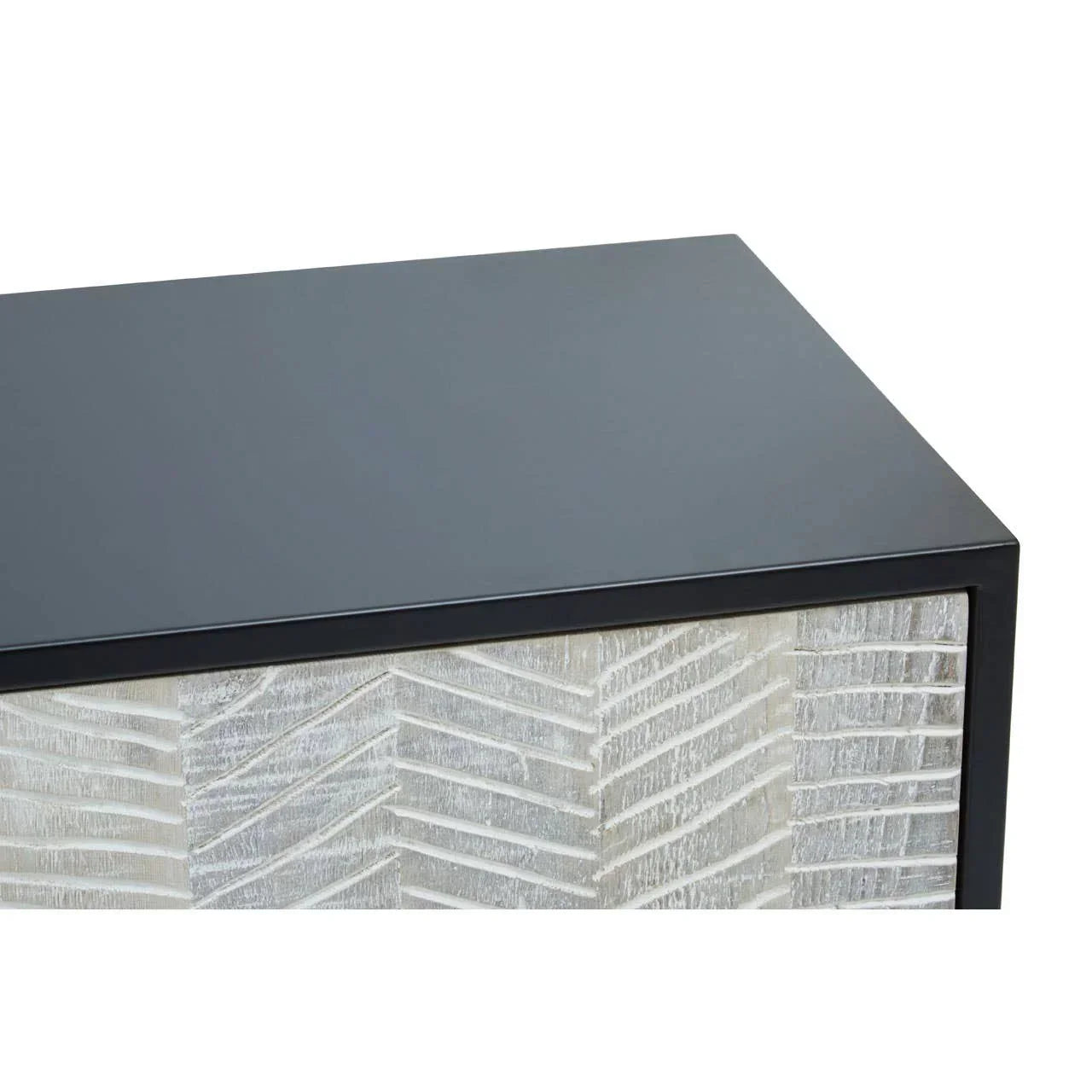 Close view of black wood sideboard top and textured chevron drawer front