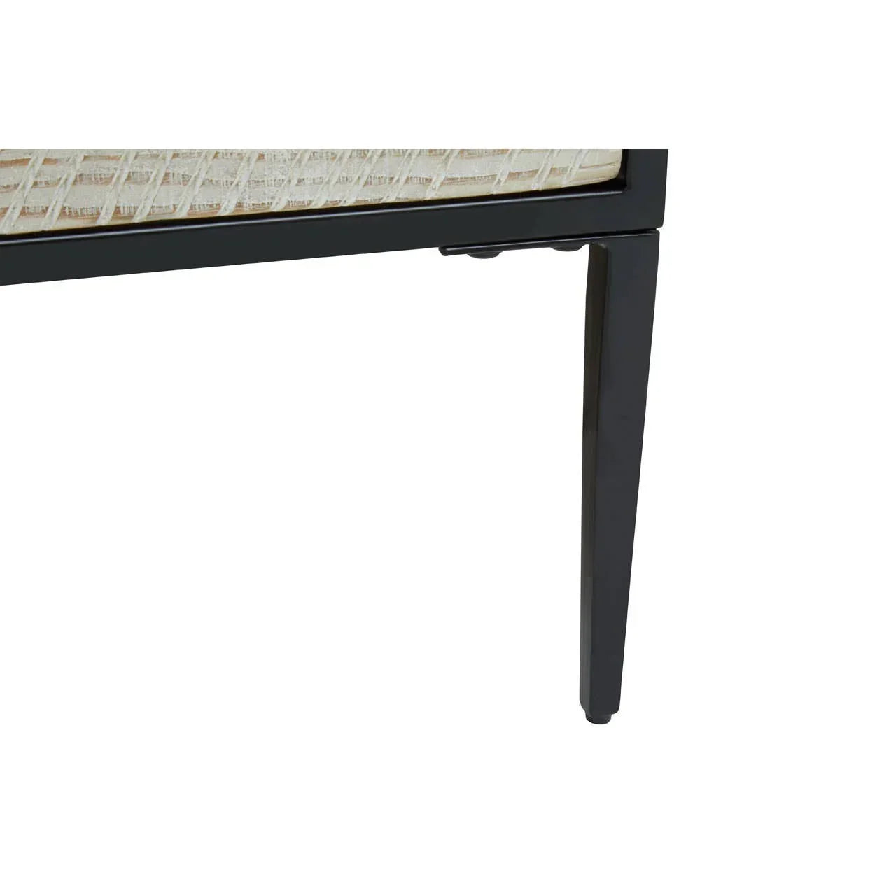 Metal dining table leg with black finish and wicker tabletop corner detail