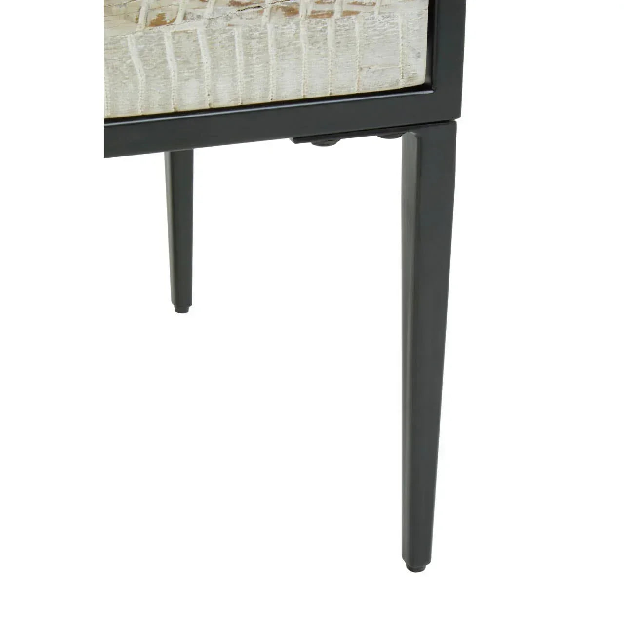 Close-up of black metal furniture leg and textured wooden tabletop corner