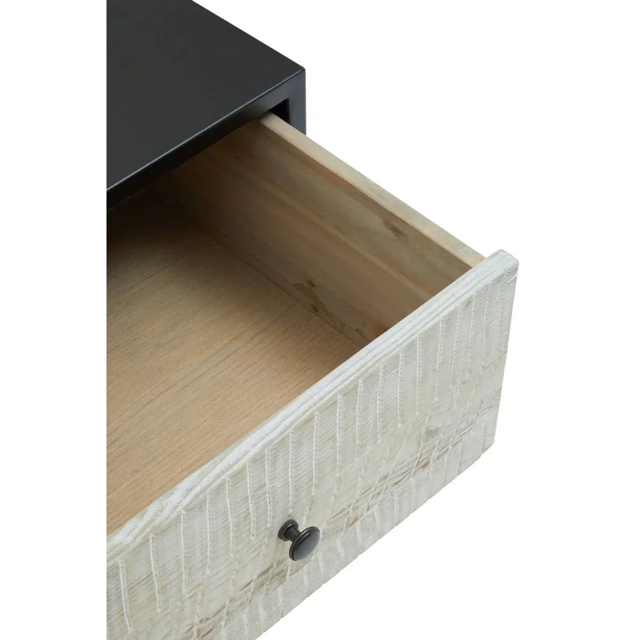 Closeup of wooden drawer with textured white front and black knob, partially open