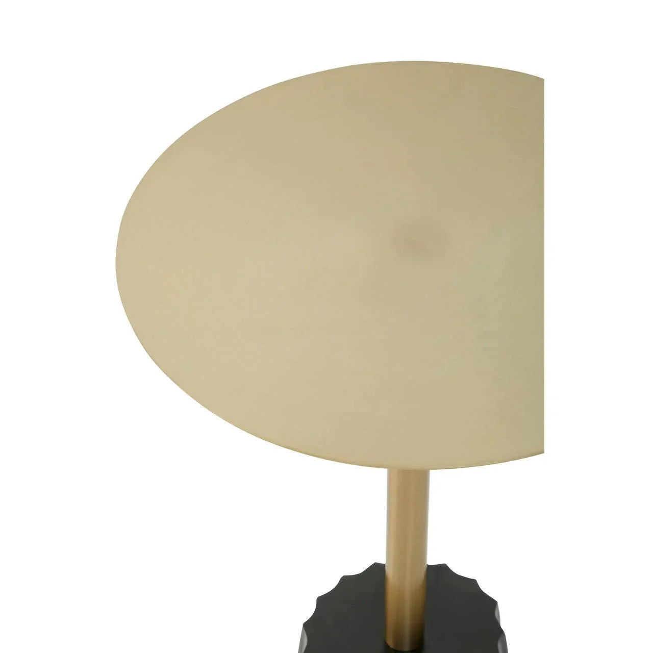 Gold metal lamp with round shade and black base, partial top view