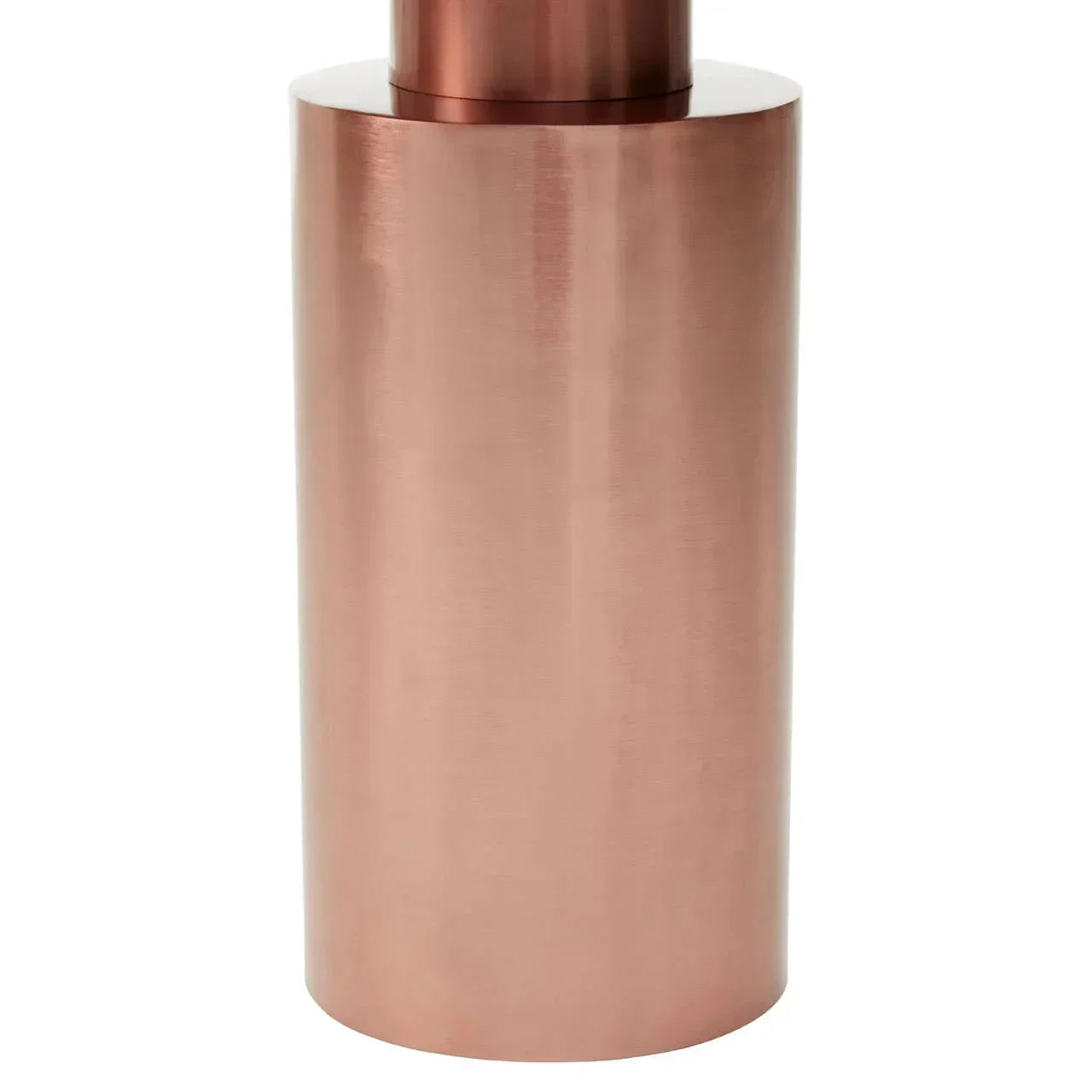 Copper finish metal table base with cylindrical shape, close-up view