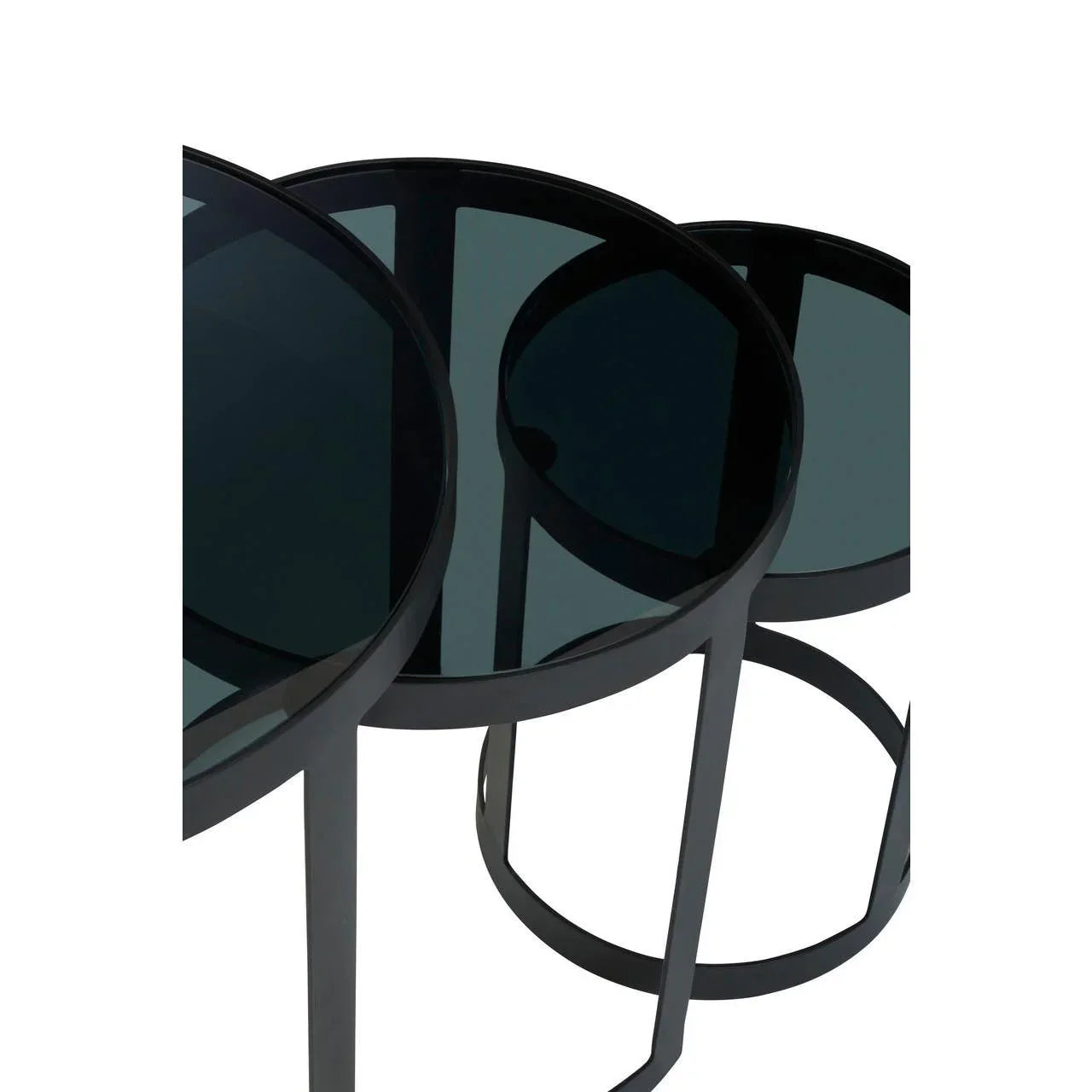 Black glass nesting tables with round tops and metal legs, angled close-up view