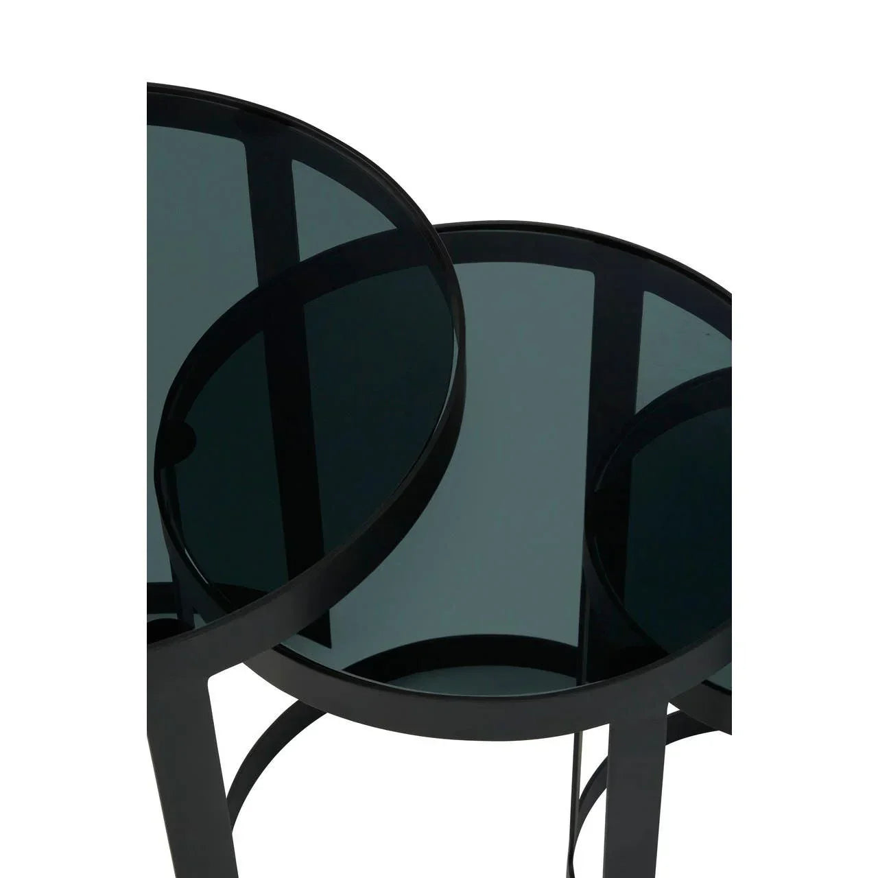 Black glass nesting tables with round tops and metal frames, close-up view
