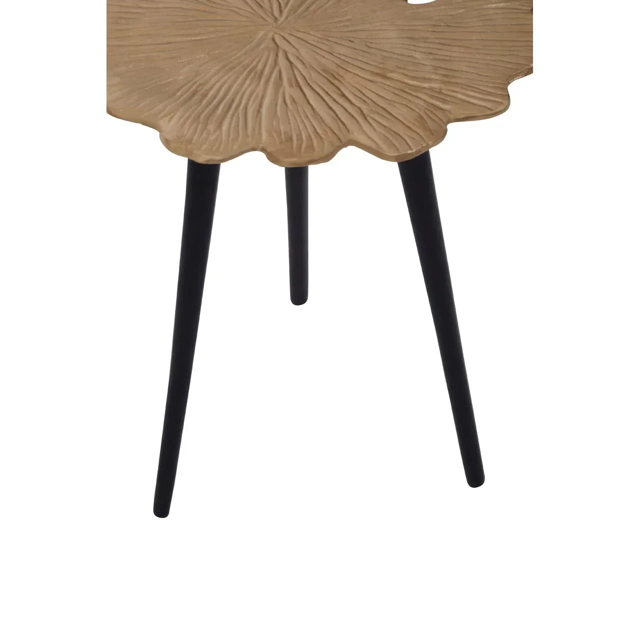 Wooden accent table with black legs and carved floral pattern on top